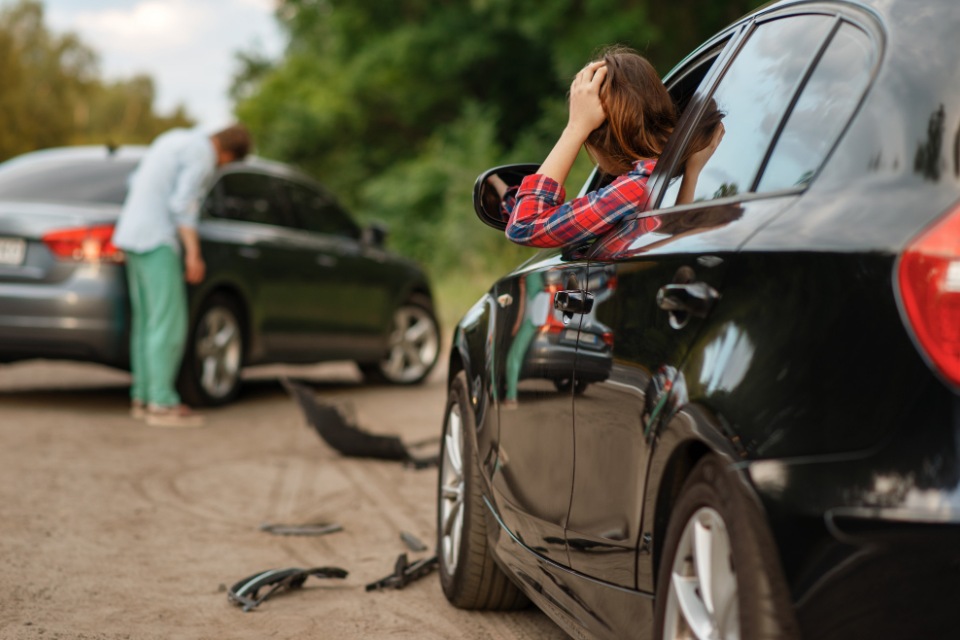 California Auto Accident Attorneys | Male and female after car accident on road | Her Lawyer