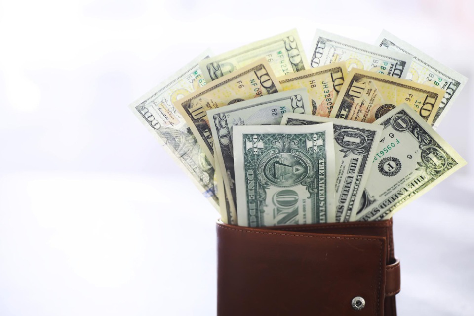 California Workers’ Compensation Attorneys | Money in wallet | Her Lawyer