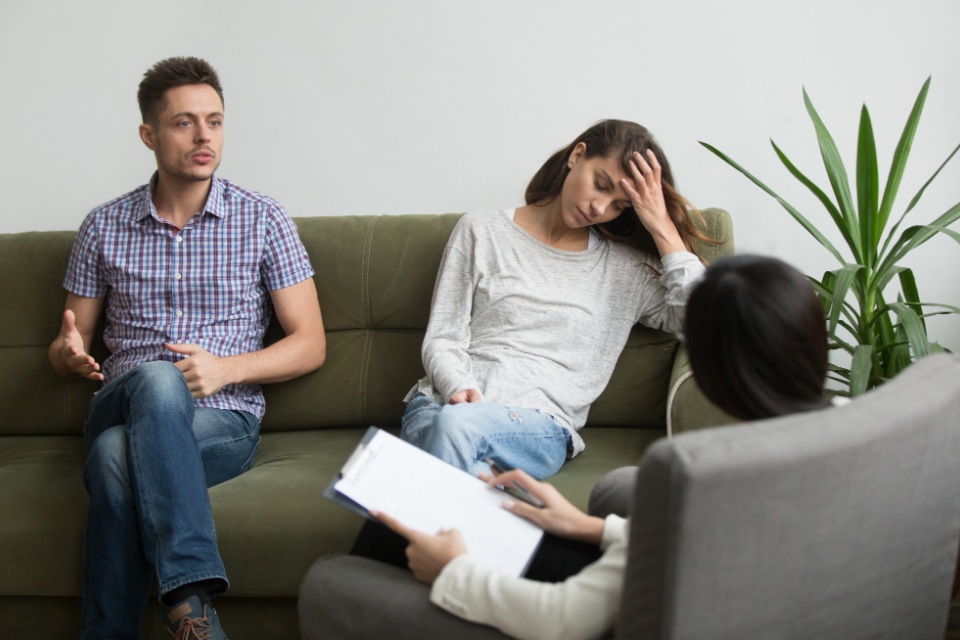 Georgia Divorce Attorneys for Women | Sad couple having discussion with lawyer | Her Lawyer