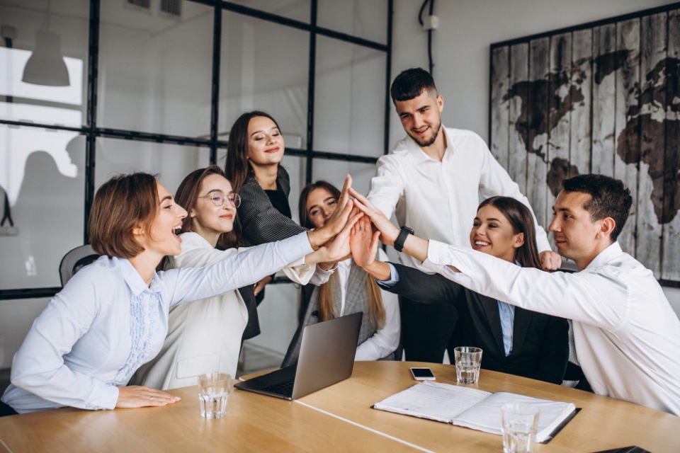Wisconsin Employment Attorneys for Women | Employees working on a business plan in office | Her Lawyer